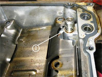 3. Clean the pistons by putting 118-147 ml (4-5 oz) of Upper Engine and Fuel Injector Cleaner, GM P/N 88861802 (in Canada, use 88861804), in each cylinder. Allow the material to soak for at least 2.