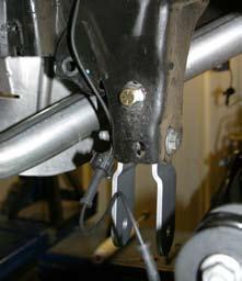 31. Disconnect the OEM upper & lower control arms from frame rail. Only remove one side at a time so that the axle does not move. Install the new Skyjacker upper/lower arm relocation bracket.