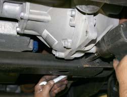 (See Photo # 8) 10. Support the front differential using a transmission jack.