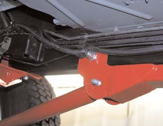 With new Sub-Frame attached by the bottom bolts, drill the outer mounting locations using a 1/2 drill bit.