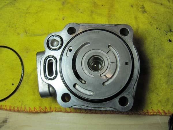 #31 Clean off the pump cover and install three new O Rings (every O Ring should be coated in PS fluid
