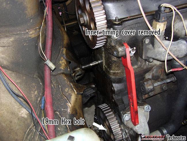 In the middle of the timing cover, you need to take off the two 13mm bolts from the front part of the bracket (they also hold on part of the alternator Bracket or a/c bracket).