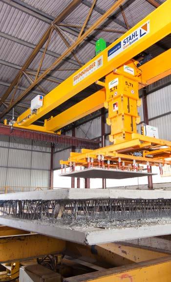 1 Six double girder overhead travelling cranes with a lifting capacity of 25 US tons each wait for parts in the transfer station of an Italian-American aircraft manufacturer.
