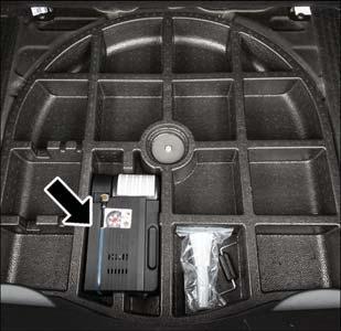 WHAT TO DO IN EMERGENCIES TIRE SERVICE KIT STORAGE The Tire Service Kit is located in the rear storage compartment inside a storage container.