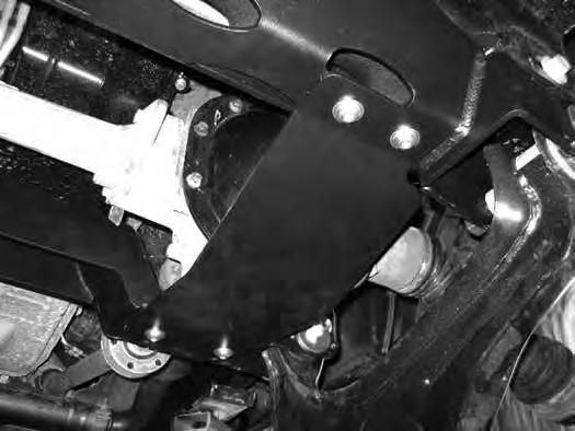 Install the front crossmember in the front lower control arm pockets and fasten with the OE lower control arm hardware. Leave hardware loose. 34.