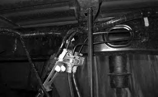 Attach the brake line to the relocation bracket with a ¼ nut and ¼ USS washer (BP #774). It may be necessary to rotate the OE brakeline clip bracket to have the lines face down for adequate slack.