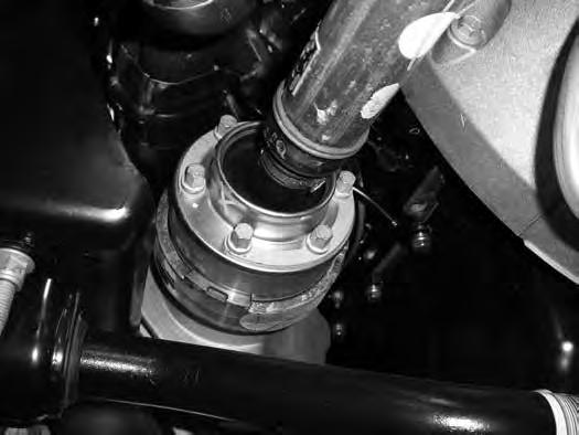 Remove the lower ball joint nut and remove the knuckle from the vehicle. Retain hardware. 17. Remove the lower control arm mounting bolts and remove the lower control arm from the vehicle.