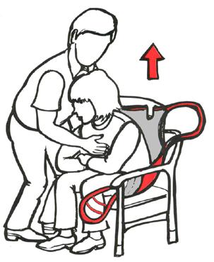 Standing by the side of the user, lean her forward - supporting with one hand. Pull sling up from behind her back. Move the lifter around the chair, and let the user rest her feet on the chassis.