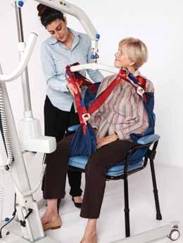 With the patient sitting in the chair, lean the patient forward and slide the sling down the back of the chair. Tuck the bottom of the sling under the tailbone.