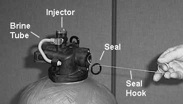 Grasp the back plate on both sides and slowly pull end plug and piston assembly out of the valve body (see Figure 6) and lay aside. Figure 7 7.
