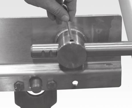 Installation 8. Insert the pull pins (Figure, item ) on the tension end of the conveyor.. Attach the chain return shoes (Figure, item ) to the return shaft (Figure, item ).