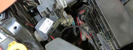 Remove the factory 20A fuse from the appropriate fuse slot and install it to the bottom slot of the