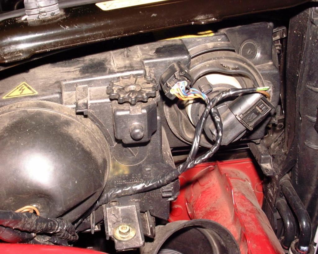 35. Reroute the wiring for the igniter and plug it in. NOTE: You will need to unclip the wiring from the car and separate the igniter wiring from the headlight wiring to make it reach.