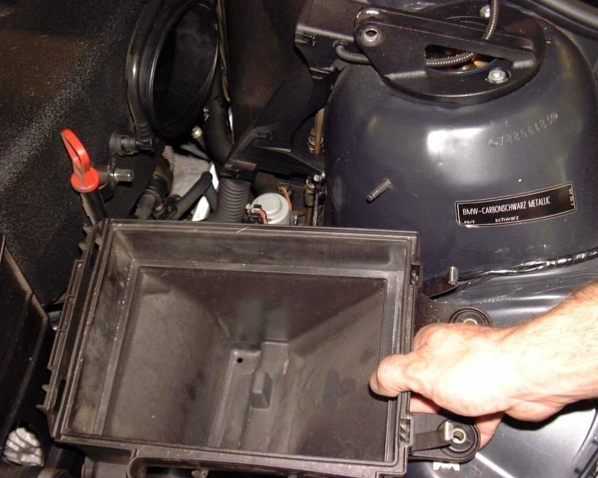 You already removed the bolts that hold the bottom half of the air box in the car so simply lift it out. Remove the lower rubber airbox mount by pulling it straight up off the frame rail.