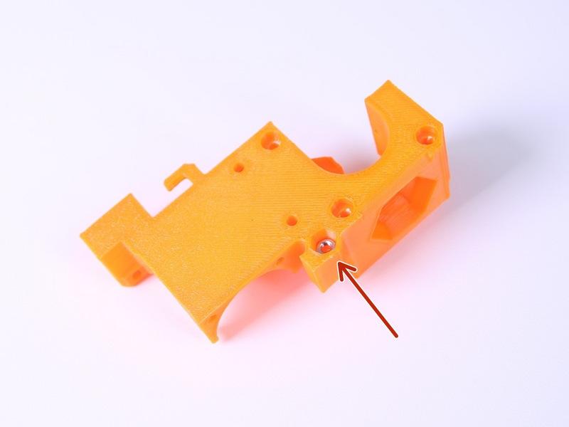 the traps on the left side of the extruder body.