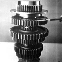 REASSEMBLY - FRONT SECTION 25. Force both the reverse gear and auxiliary drive gear downward on the shaft to flatten their respective snap rings.