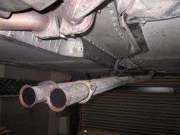 - Lift the rear shield in position, fasten the rear two bolts that were removed from the stiffening plate finger tight.