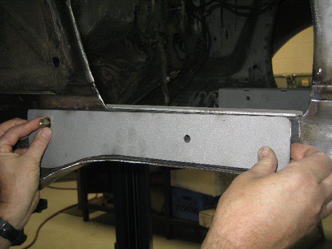 Align the rear hole in the folded bracket with the existing hole on the frame rail (drivers side 7/16 x 3 bolt) and the upper idler arm hole (passenger side 3/8 x 3 bolt).