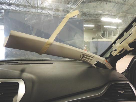 Secure the trim panels to the windshield with tape. See Figure 6.
