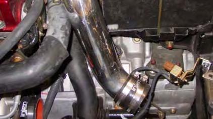 Remove the blow-off valve from the stock intake duct.