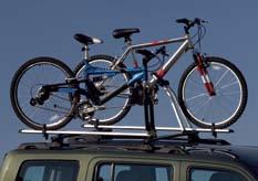 the carrier. Both styles feature carrying clamps with rubber inserts, a cable to lock bikes to the carrier and an antitheft bolt that locks the carrier to your vehicle.