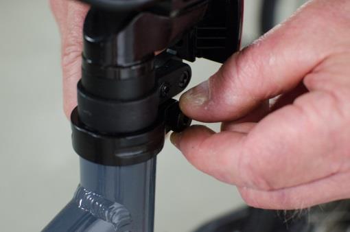 Adjust the nut on the seat clamp so when the clamp is pushed in the seat is tight.