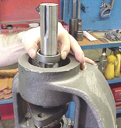Install the bracket bushing. If bracket bushing has a lubrication groove, install bushing with the lubrication hole aligned with the grease-fitting hole on the bracket. Figure 8, page 5.
