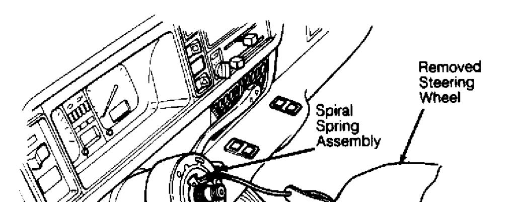 Article Text (p. 6) Fig. 7: Removing Spiral Spring Assembly 1) To install spiral spring assembly, reverse removal procedure.