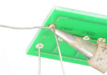 5 APPLY SOLDER Feed a small amount of solder