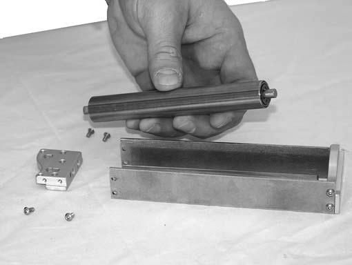 . Install pinch roller onto roller mounting block, mating squared roller end (Figure 4, item ) with slotted area (Figure 4, item ) on mounting block