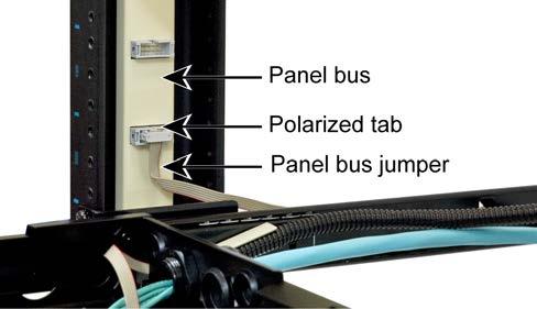 Figure 10 Positioning the Panel Bus Jumper Outside the Shelf (Top View) 8.