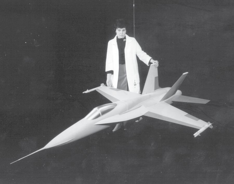 Langley Contributions to the F/A-18 Project engineer Sue Grafton with the free-flight model of the YF-17 in 1973.