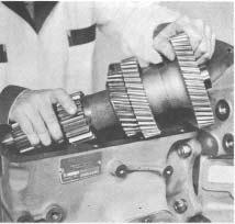 Figure 61 - Tip rear of countershaft down and into transmission case.