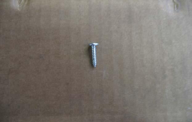 Locate the ¾ long Philips screw.