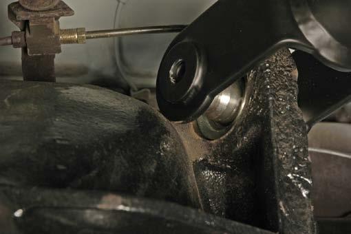 Slide the folded clevis over the bushing on the axle housing and secure with the 1/2-20 x 4 hex bolt, flat