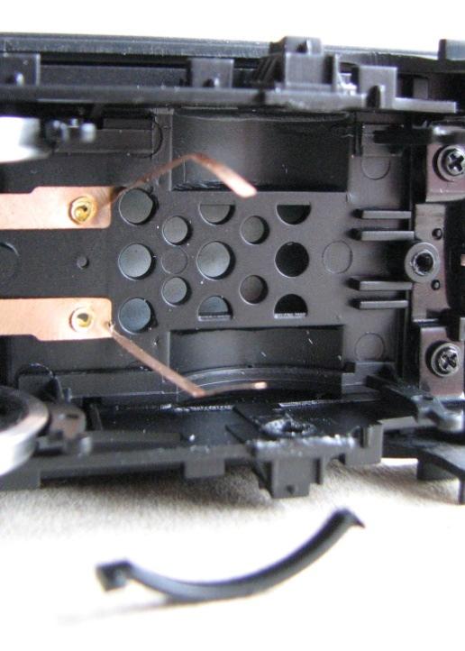Upper piece of brake moulding cut away. Lower one still to remove. 13. The brake gear can be clipped back in place, or left until later as it makes plugging loco/tender together a bit easier.