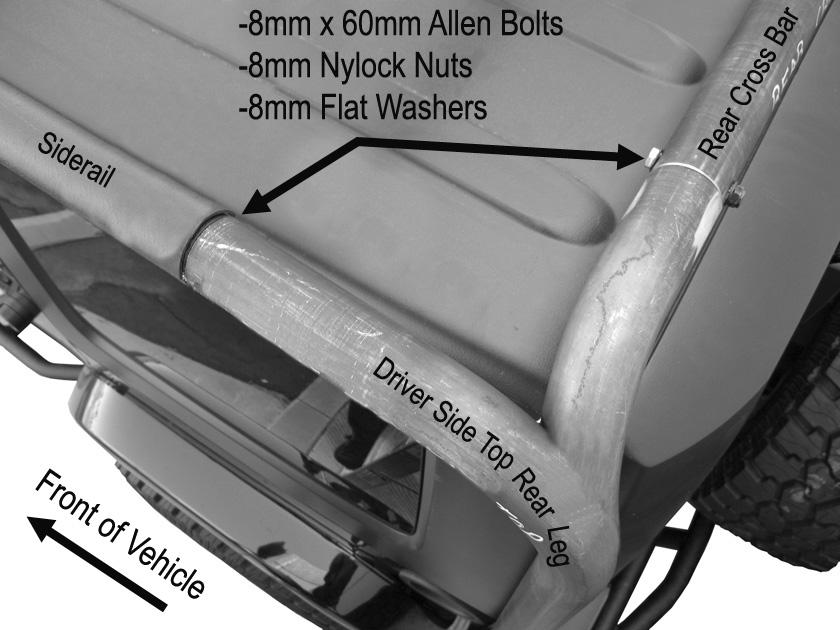With assistance, attach the assembled rear top section of the Roof Rack to the already inserted Side Rails. NOTE: Be careful not to damage the vehicle when attaching the top section.