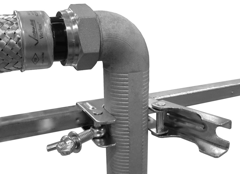 above.... Apply light downward pressure, as shown above, to maintain the position of the end bracket flat against the T-bar rail.