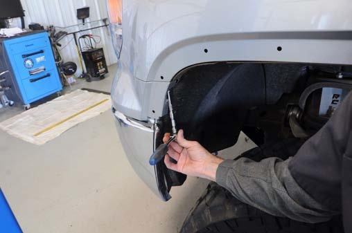 Set aside to avoid scratching or damage. Photo 3 Photo 4 Remove fender trim.