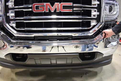 Remove the grille from the truck and lay face down on a towel or soft surface to keep from scratching.