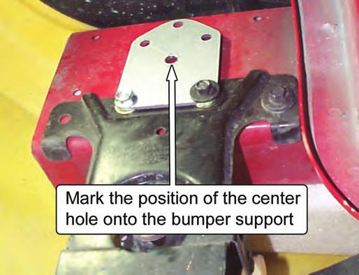 7. Mark the location of the center hole of the Adapter Plate on the bumper support. 8. Remove the Adapter Plate. 13.