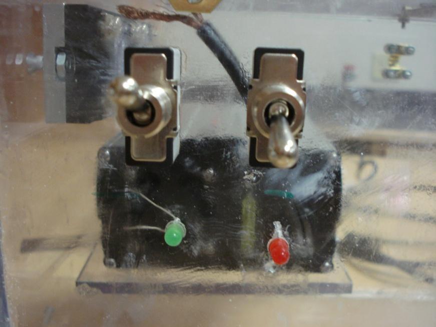 Make sure the discharge switch is off (in the down position) and the charge switch is on (in the up position) as shown in figure 4. The switches are located on the outside of the power supply case.