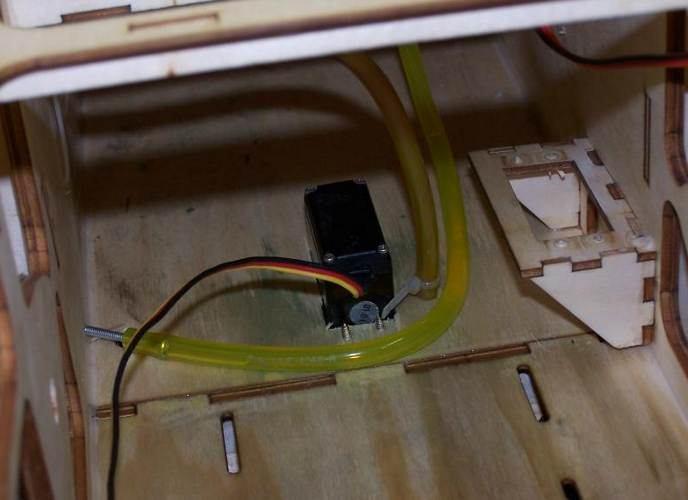 Assemble the throttle servo mount using the supplied laser cut parts or there is a