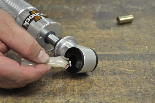 12. Press one bushing into each side of the bushing eyes. 13.