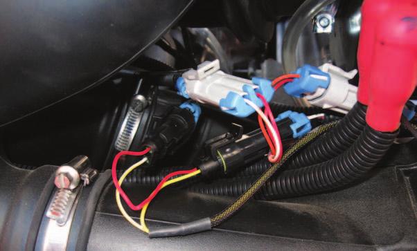 These connectors are located next to the ignition coils. FIG.