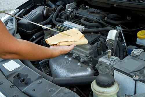 With the engine off, open the car s hood and pull the dipstick out from the engine and wipe any oil off from its end. Then insert the dipstick back into its cylinder and push it all the way back in.