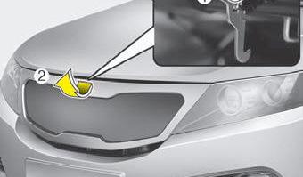 Unhook the latch and carefully lift up the hood. 3. Once the hood is open, secure the safety mechanism if your vehicle has one.