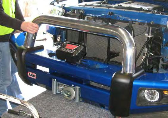FITTING PROCEDURE BAR ON VEHICLE 75. Using two people, three if winch fitted, position the bar assembly on the vehicle mounts. Caution: This product is heavy, especially if a winch is fitted.