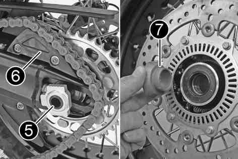 Push the rear wheel forward as far as possible. Take the chain off of the rear sprocket and place it on chain sprocket guard.