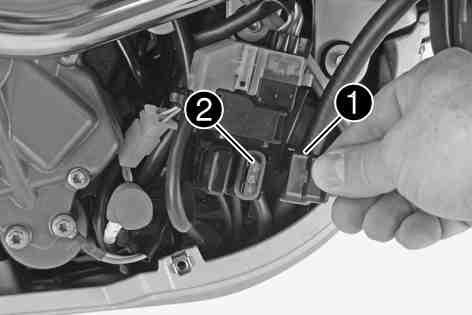 Mount the protective cover. Tip Place the spare fuse in the storage compartment so that it is available if needed.